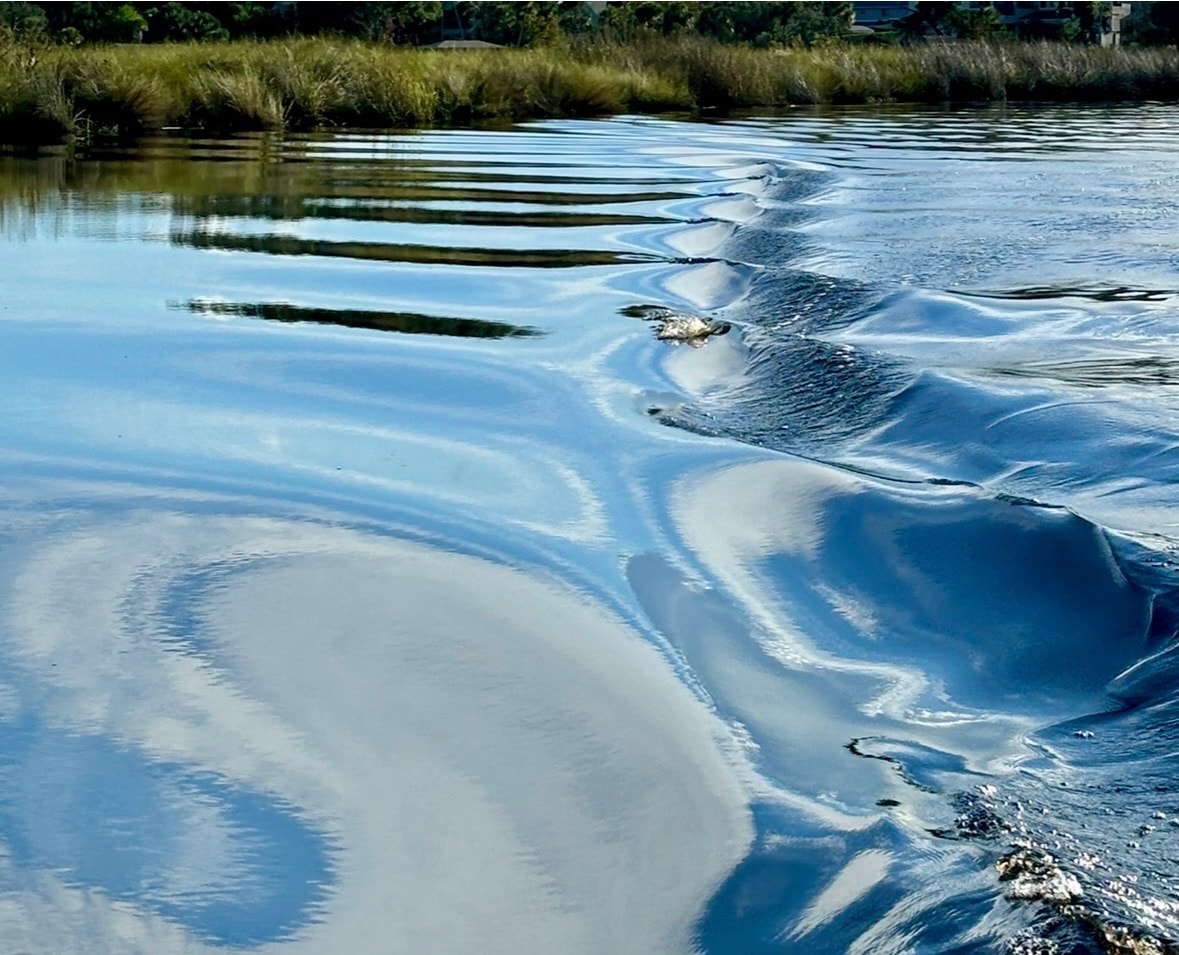 Tidal estuary with rippling water patterns